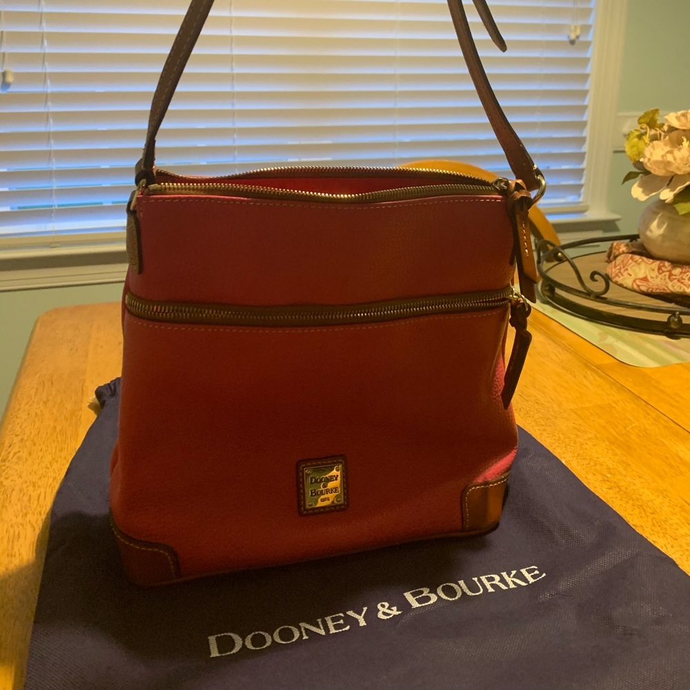 Gently used Dooney & Burke purse in Fushia.